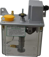 Trico - 2 L Reservoir Capacity, 3 - 6 cm Output per Cycle, 36-72 cm Output per Hour, Electric Central Lubrication System - 5 Min Interval Between Cycles, 130mm Wide x 225mm High, 110 Volts, Oil, 5/16-24 Outlet Thread - Apex Tool & Supply