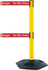 Tensator - 38" High, 2-1/2" Pole Diam, 4 Way Stanchion - 19" Base Diam, Octagon Recycled Rubber Base, Yellow Plastic Post, 7-1/2' x 2" Tape, Dual Line Tape, For Outdoor Use - Apex Tool & Supply