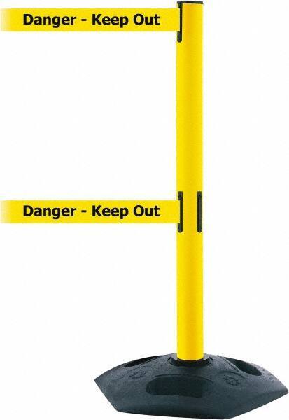 Tensator - 38" High, 2-1/2" Pole Diam, 4 Way Stanchion - 19" Base Diam, Octagon Recycled Rubber Base, Yellow Plastic Post, 7-1/2' x 2" Tape, Dual Line Tape, For Outdoor Use - Apex Tool & Supply