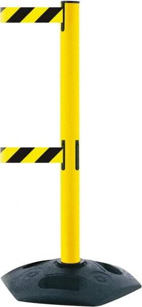 Tensator - 38" High, 2-1/2" Pole Diam, 4 Way Stanchion - 19" Base Diam, Octagon Recycled Rubber Base, Yellow Plastic Post, 7-1/2' x 2" Tape, Dual Line Tape, For Outdoor Use - Apex Tool & Supply