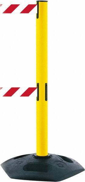 Tensator - 38" High, 2-1/2" Pole Diam, 4 Way Stanchion - 19" Base Diam, Octagon Recycled Rubber Base, Yellow Plastic Post, 7-1/2' x 2" Tape, Dual Line Tape, For Outdoor Use - Apex Tool & Supply