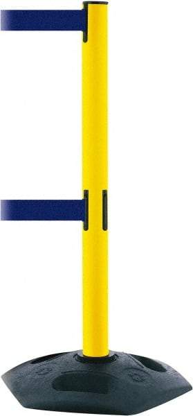 Tensator - 38" High, 2-1/2" Pole Diam, 4 Way Stanchion - 19" Base Diam, Octagon Recycled Rubber Base, Yellow Plastic Post, 7-1/2' x 2" Tape, Dual Line Tape, For Outdoor Use - Apex Tool & Supply