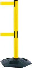Tensator - 38" High, 2-1/2" Pole Diam, 4 Way Stanchion - 19" Base Diam, Octagon Recycled Rubber Base, Yellow Plastic Post, 13' x 2" Tape, Dual Line Tape, For Outdoor Use - Apex Tool & Supply