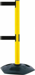 Tensator - 38" High, 2-1/2" Pole Diam, 4 Way Stanchion - 19" Base Diam, Octagon Recycled Rubber Base, Yellow Plastic Post, 13' x 2" Tape, Dual Line Tape, For Outdoor Use - Apex Tool & Supply