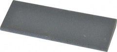 Norton - 4-1/2" Long x 1-3/4" Diam x 1/2" Thick, Silicon Carbide Sharpening Stone - Round, Fine Grade - Apex Tool & Supply