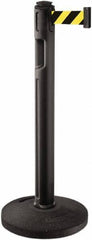 Lavi Industries - 38-1/4" High, 3-1/4" Pole Diam, Stanchion - 16" Base Diam, Dome Recycled Rubber Base, Black Plastic Post, 12' x 2" Tape, Single Line Tape, For Outdoor Use - Apex Tool & Supply