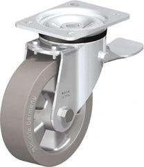 Blickle - 6-1/2" Diam x 1-31/32" Wide x 7-61/64" OAH Top Plate Mount Swivel Caster with Brake - Solid Rubber, 880 Lb Capacity, Ball Bearing, 5-1/2 x 4-3/8" Plate - Apex Tool & Supply