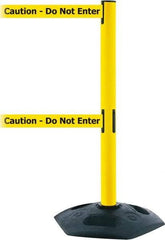 Tensator - 38" High, 2-1/2" Pole Diam, 4 Way Stanchion - 19" Base Diam, Octagon Recycled Rubber Base, Yellow Plastic Post, 7-1/2' x 2" Tape, Dual Line Tape, For Outdoor Use - Apex Tool & Supply