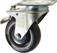 Value Collection - 4" Diam x 1-1/4" Wide x 5-13/32" OAH Top Plate Mount Swivel Caster with Brake - Polyurethane, 235 Lb Capacity, Ball Bearing, 2-7/8 x 3-5/8" Plate - Apex Tool & Supply