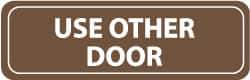 NMC - Use Other Door, 11" Wide x 3.5" High, Acrylic Sign - English, White on Brown, Wall Mount - Apex Tool & Supply